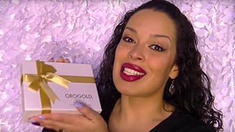 Adriana Pina, YouTube vlogger, holding the OROGOLD Box